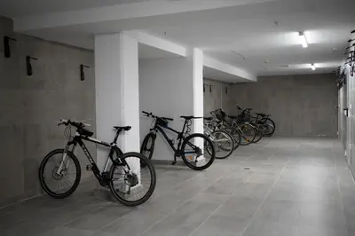 a row of bikes parked in a room at micampus Avenida del Puerto - Residencia de Estudiantes in Valencia