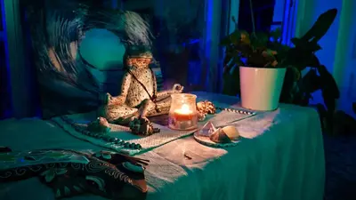 a table with a figurine and a candle on it at BLUE DOUBLE PRIVATE ROOM AT FRONT BEACH - HABITACION en la playa piso compartido in Valencia