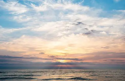 a sunset over the ocean with a cloudy sky at BLUE DOUBLE PRIVATE ROOM AT FRONT BEACH - HABITACION en la playa piso compartido in Valencia