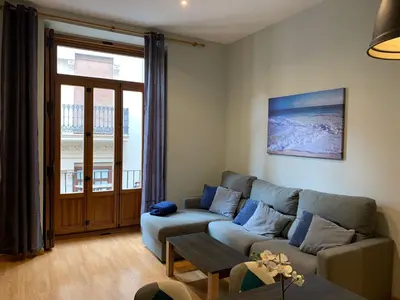 a living room with a couch and a table at Apartment Plaza de la Merced in Valencia
