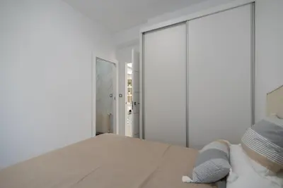 a bedroom with a bed and a mirror at DREAM HOUSE in Burriana