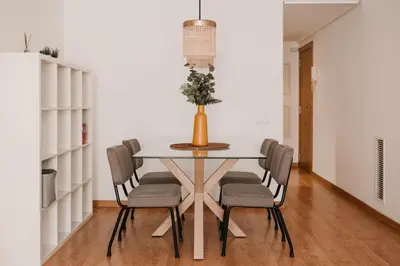a dining room with a table and chairs at Patacona Beach Apartment in Alboraya