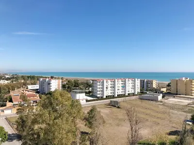 an aerial view of a city and the ocean at Global Vacacional, Apartamento con vistas al mar, Canet d'en Berenguer in Canet de Berenguer