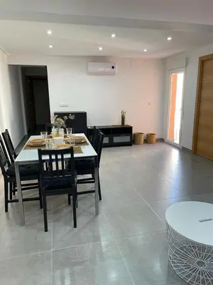 a dining room with a table and chairs in a room at UIM Mediterraneo Alicante Wifi in Puerto de Sagunto