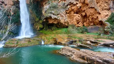 a waterfall in a canyon with a pool of water at Casa Rural Matilde in Caudiel