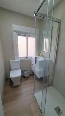 a bathroom with a toilet and a sink and a shower at CHALET VILLA Los HIPOCAMPOS in Cullera