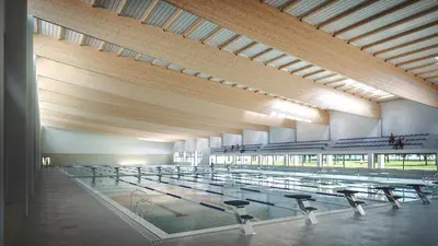 a large hall with rows of tables and benches at Luxotica Gardens Valencia in Valencia