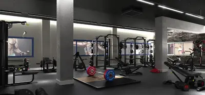a gym with several treadmills and machines in it at Luxotica Gardens Valencia in Valencia