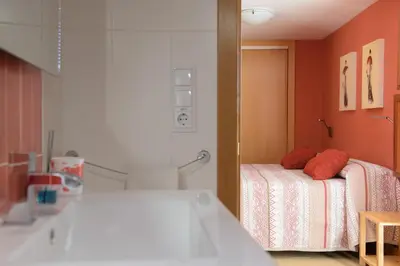 a hospital room with a bed and a mirror at Casa Lucía in Requena