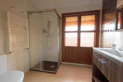 a bathroom with a shower and a toilet and a sink at Casa Lucía in Requena