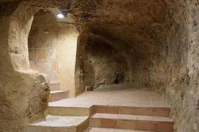 a stone tunnel with stairs in a building at Casa Lucía in Requena