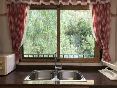 a kitchen sink in front of a window at Apartamentos La Muela - Chulilla in Chulilla