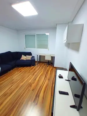 a living room with a couch and wooden floors at Precioso piso in Catarroja