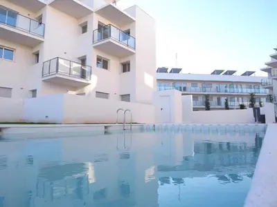 a large swimming pool in front of a building at Apartamento C2 1Dormitorio in Lliria