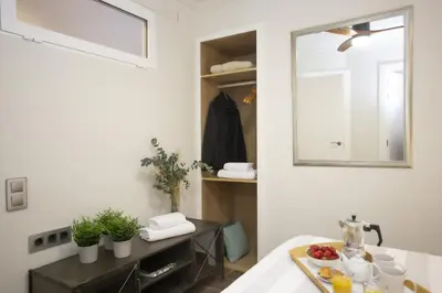 a kitchen with a sink and a mirror in a room at SingularStays Xativa III in Valencia