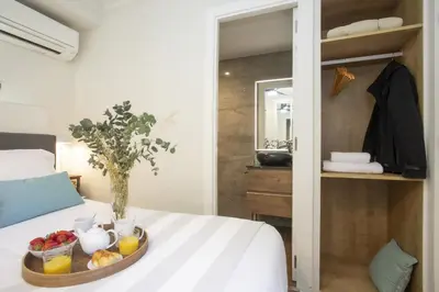 a tray of fruit on a bed in a room at SingularStays Xativa III in Valencia
