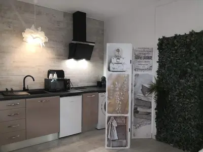 a kitchen with a refrigerator and a counter top at Cozy Rooms - BAÑERA HIDROMASAJE in Valencia
