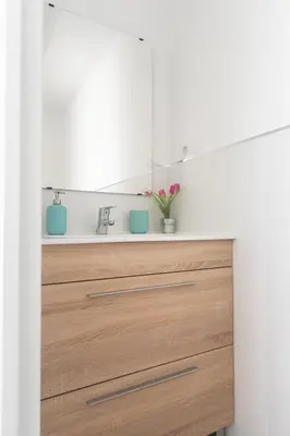 a kitchen with a wooden dresser with a mirror at Reinapart Patacona Beach 46 in Valencia