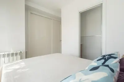 a bedroom with a bed and a large mirror at Reinapart Patacona Beach 46 in Valencia