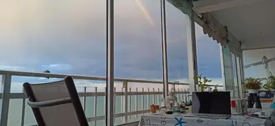 a person riding a horse in the water on the beach at SUNSET ROOM AT FRONT BEACH - HABITACION EN LA PLAYA en Piso compartido in Tavernes de Valldigna