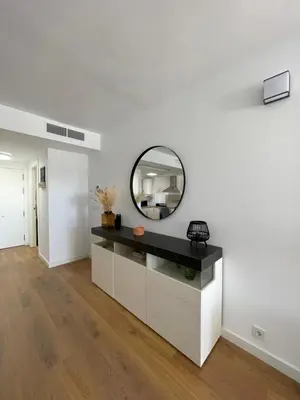 a bathroom with a mirror on a white wall at Canet De Berenguer, Playa Apto con 2 habitaciones in Valencia