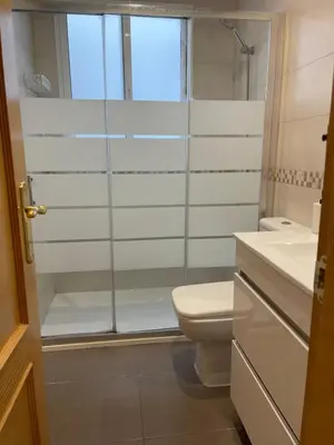 a bathroom with a shower and a toilet and a sink at UIM Mediterraneo PB America Wifi in Puerto de Sagunto