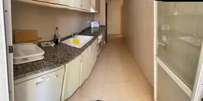 a kitchen with a sink and a counter top at MAGNIFICO ATICO-DUPLEX FRENTE AL MAR in El Puig