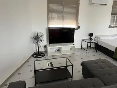 a living room with a tv and a couch at Attic Loft Gran Vía in Valencia