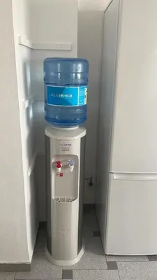 a cooler with a bucket on top of it in a refrigerator at Attic Loft Gran Vía in Valencia