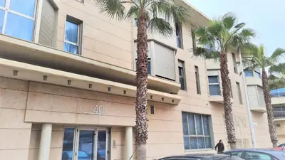 two palm trees in front of a building at BEACH VALENCIA LUXURY - B40-21 - Apartament on Beach in Valencia