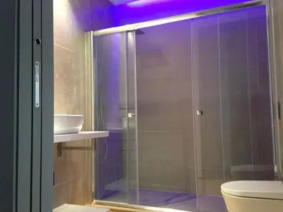 a glass shower in a bathroom with a toilet at El 16 Ruzafa in Valencia