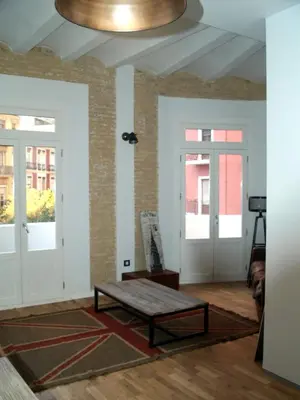 a living room with a coffee table and a ceiling at El 16 Ruzafa in Valencia