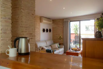 a living room with a couch and a table at SingularStays Valero in Valencia