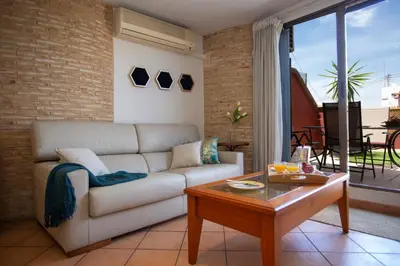 a living room with a couch and a table at SingularStays Valero in Valencia