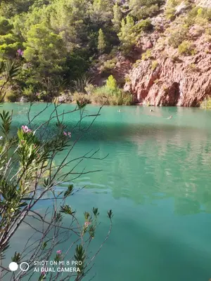 a view of the blue water of a river at La Chirrichana in Bicorp