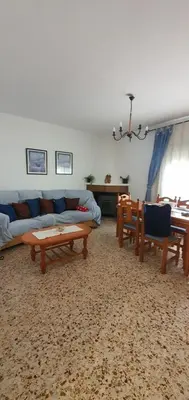 a living room with a couch and chairs and a table at La Chirrichana in Bicorp