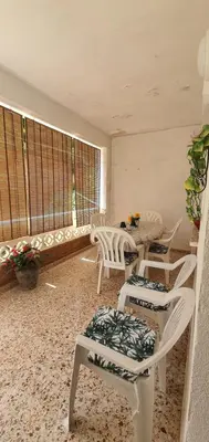 a room with chairs and a table and a window at La Chirrichana in Bicorp