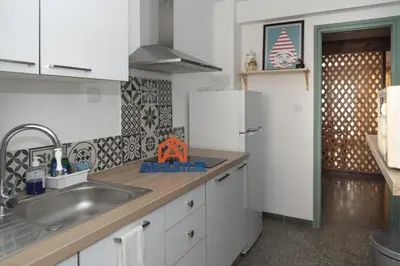 a kitchen with a sink and a refrigerator at Saint Germain, A-2-4 in Cullera