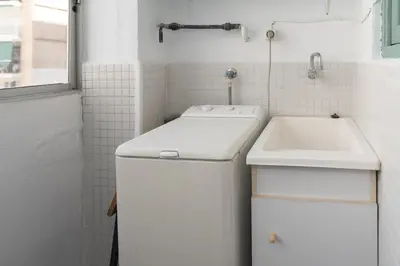 a small white bathroom with a sink and a tub at Saint Germain, A-2-4 in Cullera