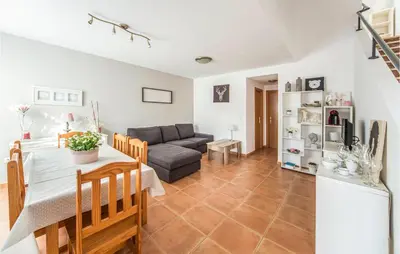 a living room with a couch and a table at 2 Bedroom Pet Friendly Home In Sagunto in Sagunto