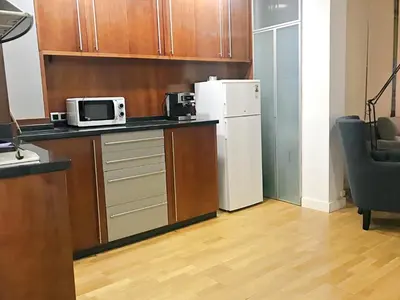 a kitchen with a refrigerator and a microwave at APARTAMENTO JUNTO AYUNTAMIENTO DE VALENCIA in Valencia