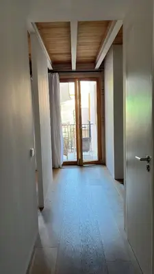 a bedroom with a bed and a large window at Design Loft near the sea in Valencia
