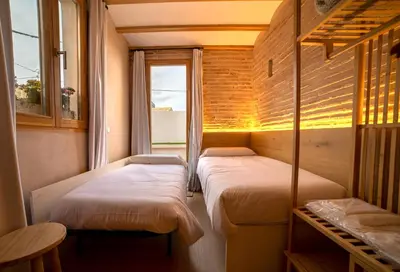 a large room with a bed and a wooden ceiling at Design Loft near the sea in Valencia