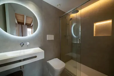 a bathroom with a toilet and a sink and a shower at Design Loft near the sea in Valencia