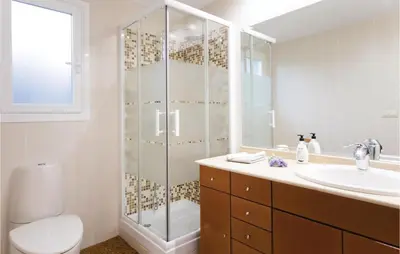 a bathroom with a shower and a toilet and a sink at Amazing Home In Riba-Roja De Túria in Riba-Roja De Turia