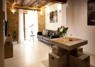 a living room with a couch and a table at Authentic Charming Apartment/Wifi/Air Conditioning in Valencia