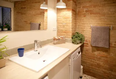a bathroom with a sink and a mirror at Authentic Charming Apartment/Wifi/Air Conditioning in Valencia