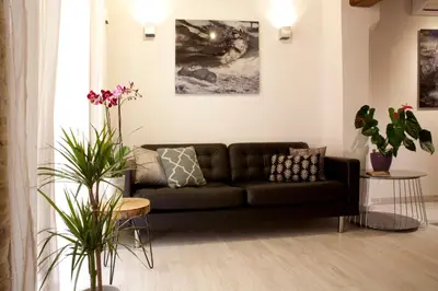 a living room with a couch and some plants at Authentic Charming Apartment/Wifi/Air Conditioning in Valencia