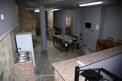 a kitchen and dining room with a table and chairs at Casa Genes Chera in Chera