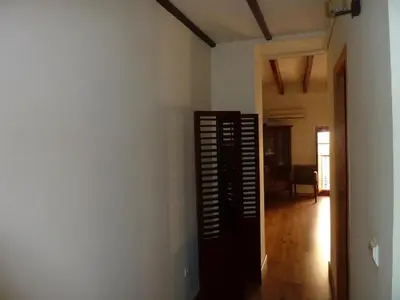 a hallway with a room with a wall with a fan at Apartamento con encanto CORONA in Valencia